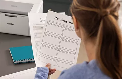 woman looking at printed documents