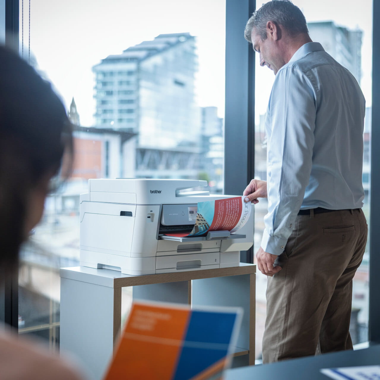 Brother MFC-J6975DW Inkjet Printer picking up paper from the output tray