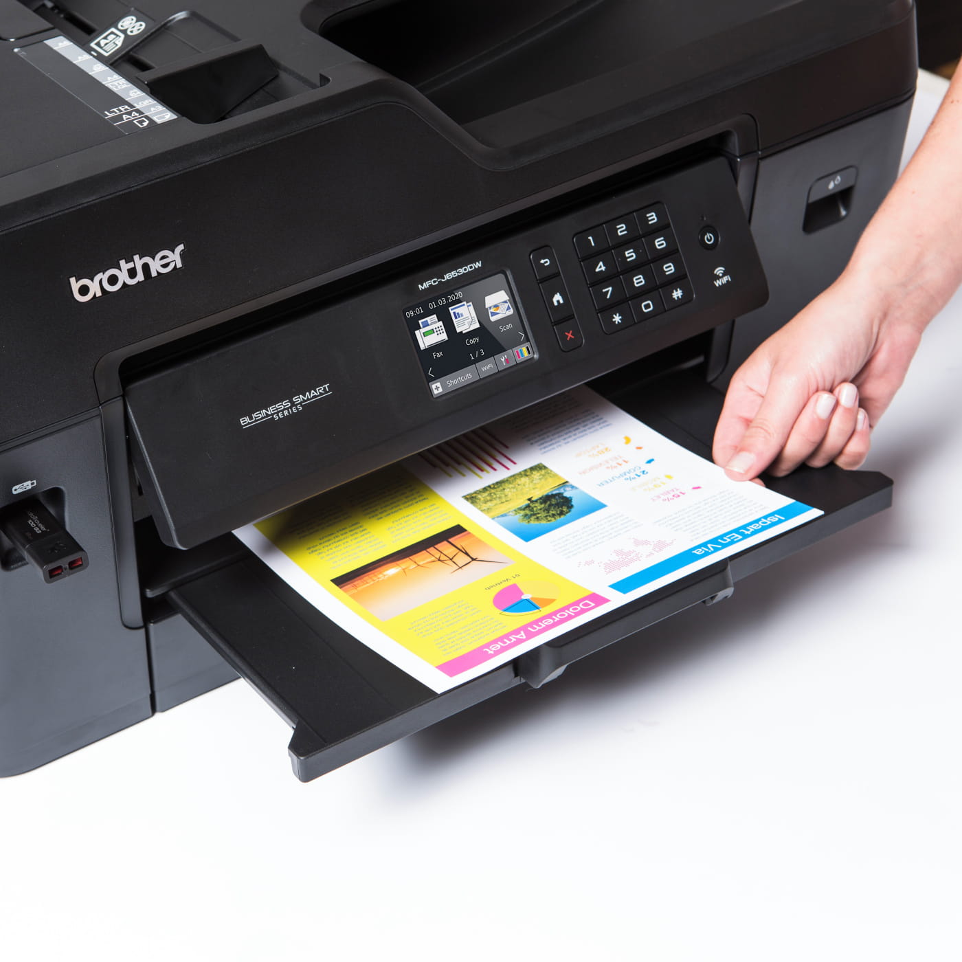 Brother MFC-J6530DW printer printing a colour page