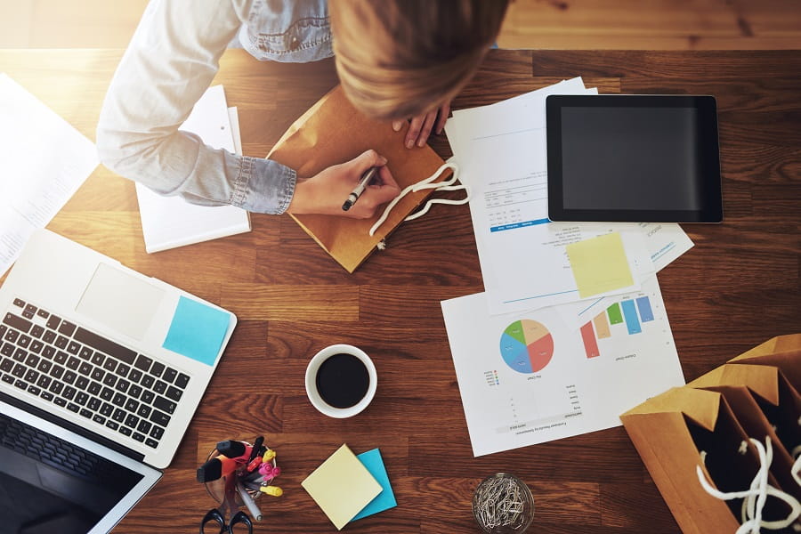 Young female entrepreneur working home in her office