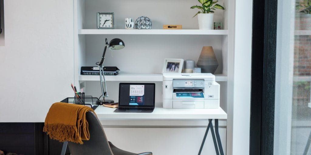 Home learning setup with laptop and printer 