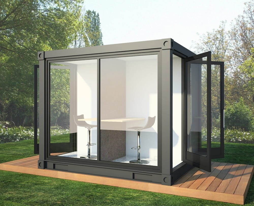 A home office pod in a backyard setting